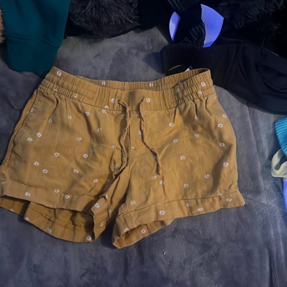 yellow shorts with white flowers